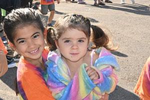 Sisters at the Miles 4 Mentors Fun Run. About Us